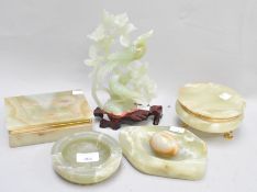 A collection of onyx ashtrays, trinket dishes and a sculpture depicting birds,