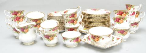 A Royal Albert "Country Roses" part tea service to include cups and saucers, cake plates,