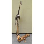 A collection of carved wood animals to include a large giraffe, 137cm high,