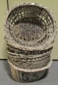 Four large wicker baskets,