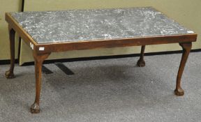 A coffee table with inset marble top,