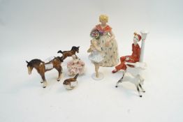 A group of figures, including Beswick horses,
