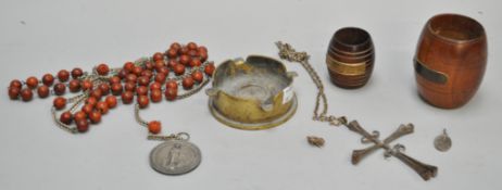 Two pieces of teak from HMS ships along with a trench art ashtray and rosary beads