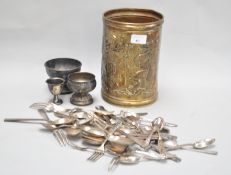 A group of silver plated items and a brass pot,