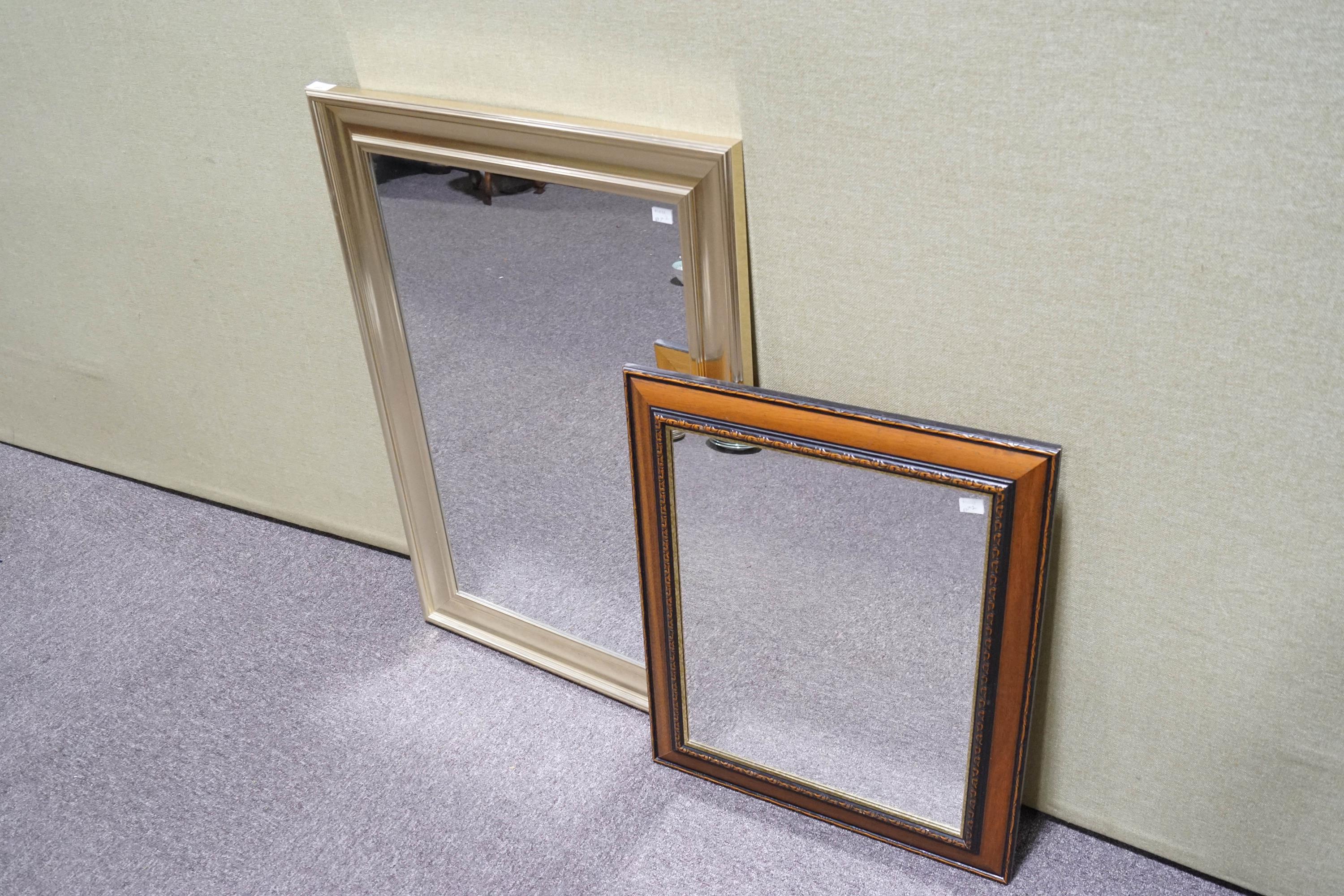 A gold effect mirror, 91cm x 66cm,