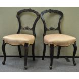 Two balloon back chairs, in mahogany on cabriole legs,