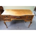 A walnut dressing table