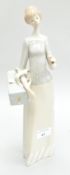 A Lladro figure of a lady, 34cm high,