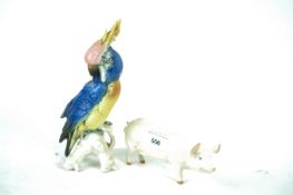 A Beswick pig and a cockatoo