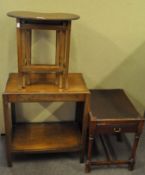 A kidney shaped nest of table along with an oak side table and a drawered mahogany piano stool,