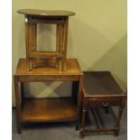 A kidney shaped nest of table along with an oak side table and a drawered mahogany piano stool,