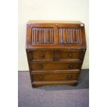 An oak linen panel bureau