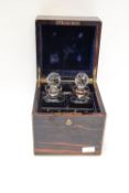 A 19th century coromandel decanter box and two cut glass decanters