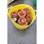 A quantity of terracotta plant pots