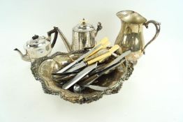 A silver plated cake basket, teapot,