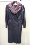 A lady's overcoat with fur collar