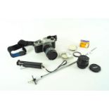 A Pentax K1000 SLR camera with accessories