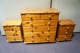 A pine chest of drawers together with two bedside tables
