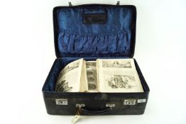 A vintage suitcase containing early newspapers and magazines,