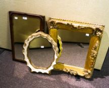 Three mirrors, to include an oval scalloped edge gilt framed mirror,