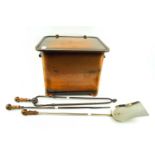 An Art Deco style copper plated coal scuttle and a set of three fire irons