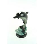 A cast iron doorstop in the form of a dolphin