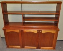 A mahogany finish sideboard and a hanging unit,