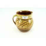 A Studio pottery red clay jug having salt glaze,