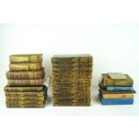 A group of assorted leather quarterbound volumes of Dickens and other books