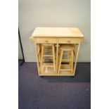 A pine kitchen table and stools unit