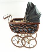 A wrought iron dolls pram