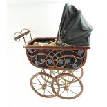 A wrought iron dolls pram