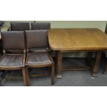 A 1930's Art Deco oak dining suite, comprising four chairs and an extending table,