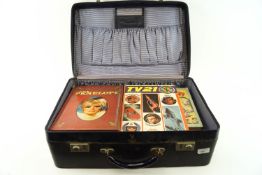 A vintage suitcase containing a collection of 1970's and earlier comics