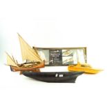 Three wood boat hull models