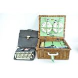A typewriter and a picnic hamper
