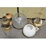 A group of various oil lamps and glass shades (1 box)