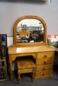 A pine dressing table and a stool