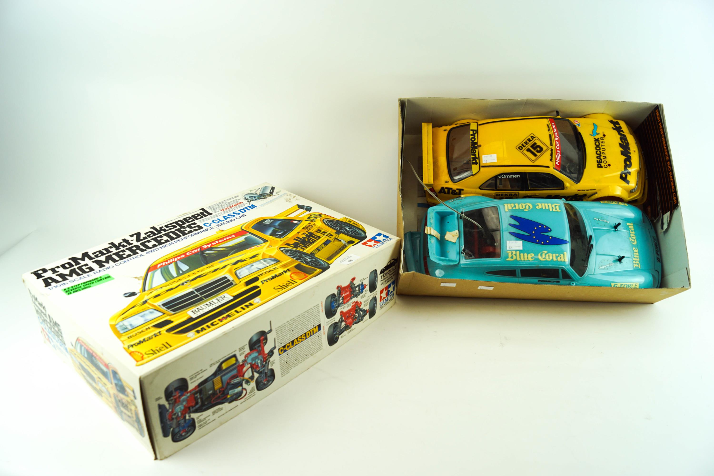 A boxed remote control 'Tamiya 58145' model kit with remote control and another car body