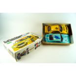 A boxed remote control 'Tamiya 58145' model kit with remote control and another car body