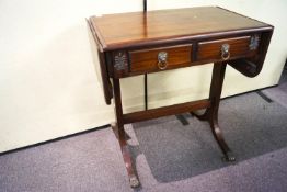 A reproduction mahogany drop end hall table with fitted frieze drawers,