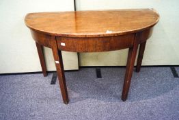 A mahogany 'D' end table with fitted frieze and raised on square legs,