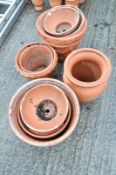 A quantity of moulded terracotta garden pots