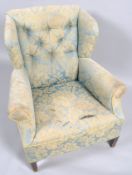 A button back armchair,