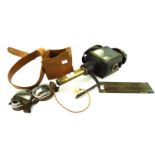 A mixed collection, including an antique car lamp, motorcycle goggles,