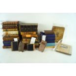 A group of assorted leather bound books,