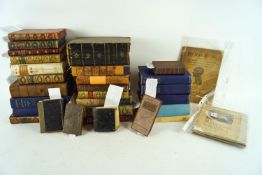 A group of assorted leather bound books,