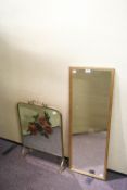 A gilt framed mirror together with a mirrored brass fire screen