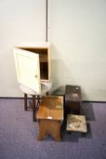 A collection of stools and a painted cupboard