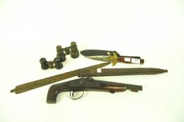 A collection of arms to include a 19th century handmade percussion cap pistol, bronze blade,